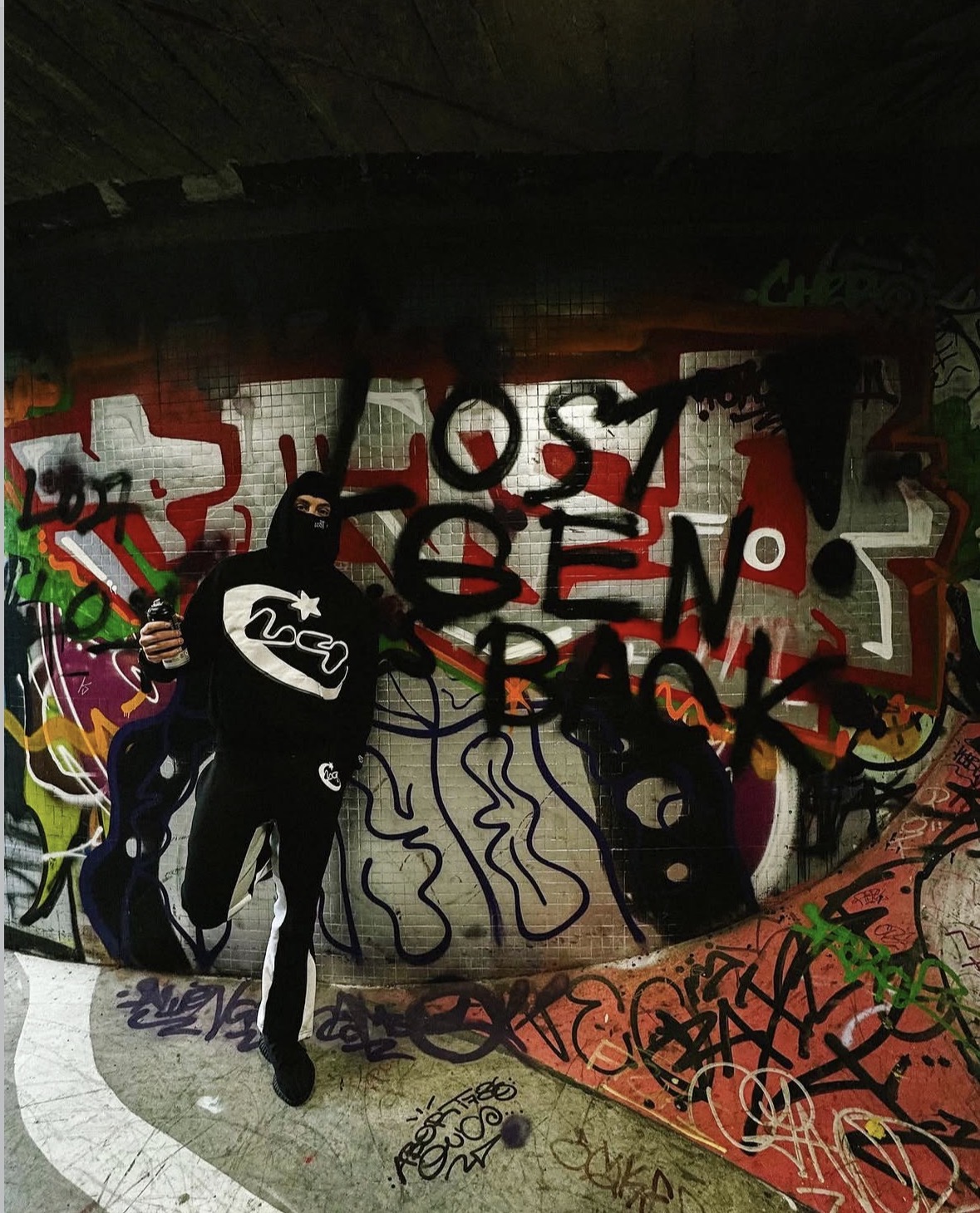 LOSTGEN streetwear in a graffiti-covered space