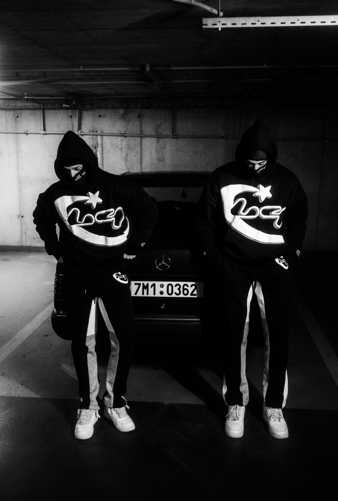 LOSTGEN crew in a garage